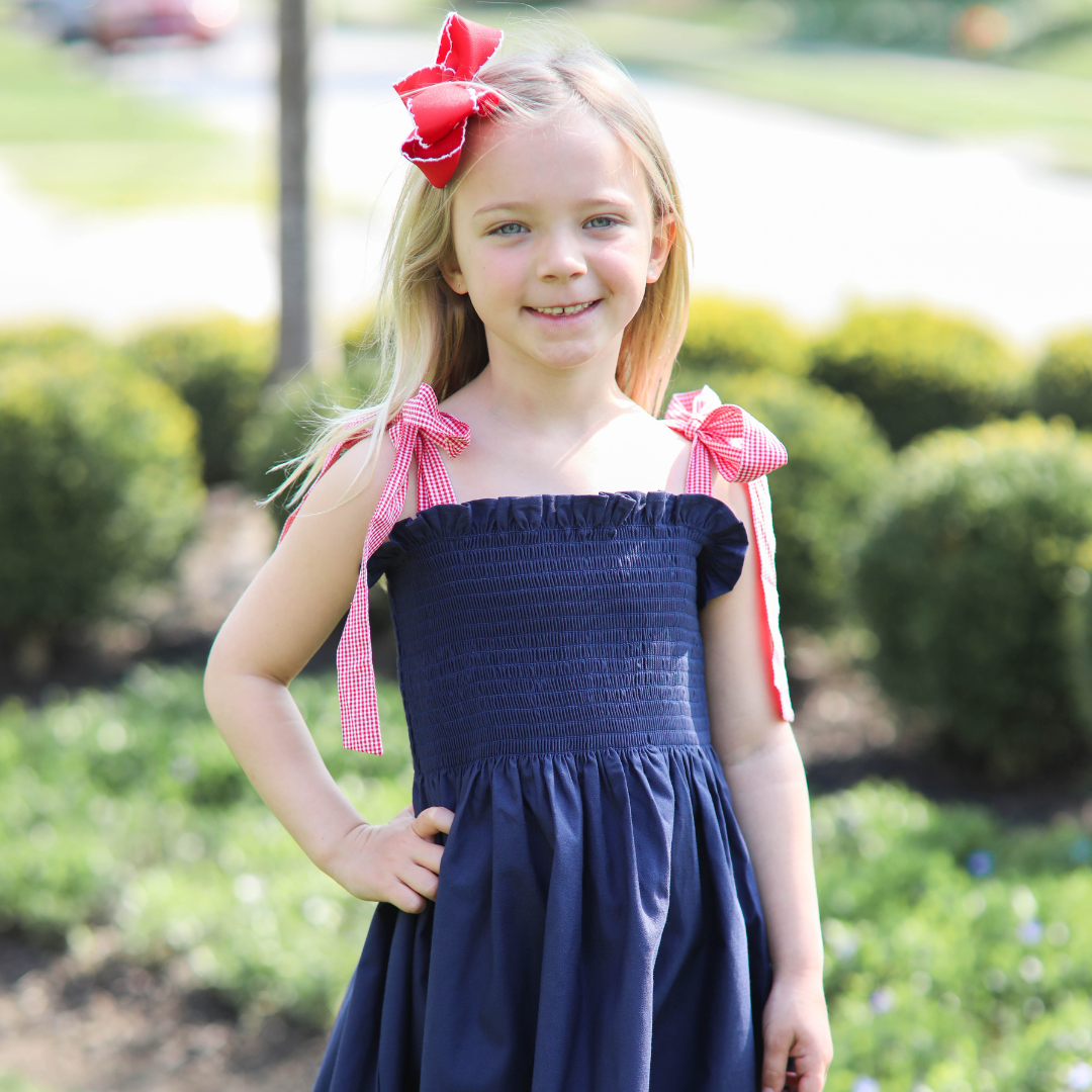 Girls Navy Smocked Dress with Gingham Tie Straps